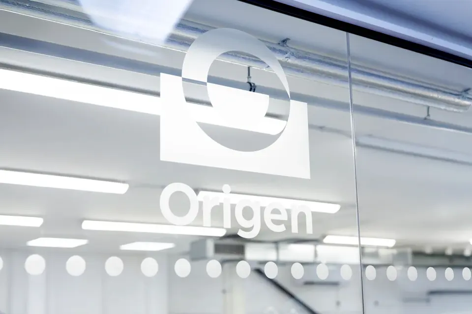 Origen logo on glass wall in Bristol site